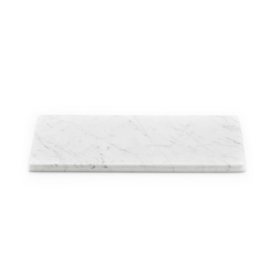 This base in white Carrara marble is designed for countless variations of everyday use: your special tray, the base for mouse and bathroom sets. Shop designer marble accessories on Luxxdesign.com