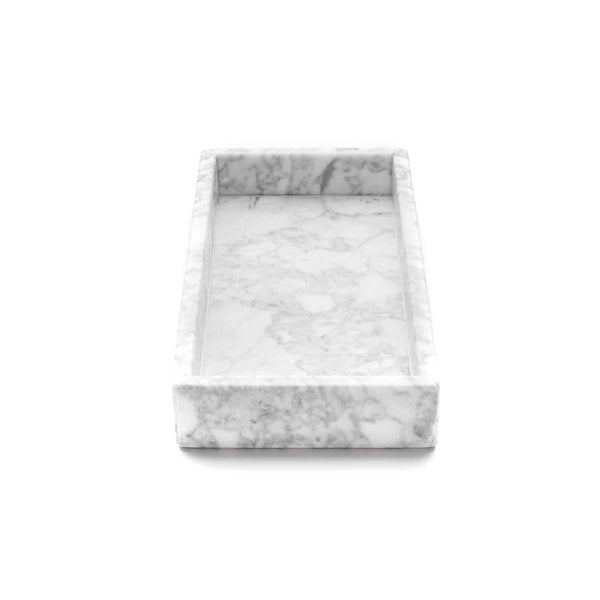 It can be used as an empty pocket on a consolle or as a spacious container in a bathroom. Meticulously hand crafted from white Carrara marble, this platter with raised edges acts as a simple yet refined centerpiece on different tables, providing also a platform for showcasing precious objects. Shop decor marble accessories on Luxxdesign.com